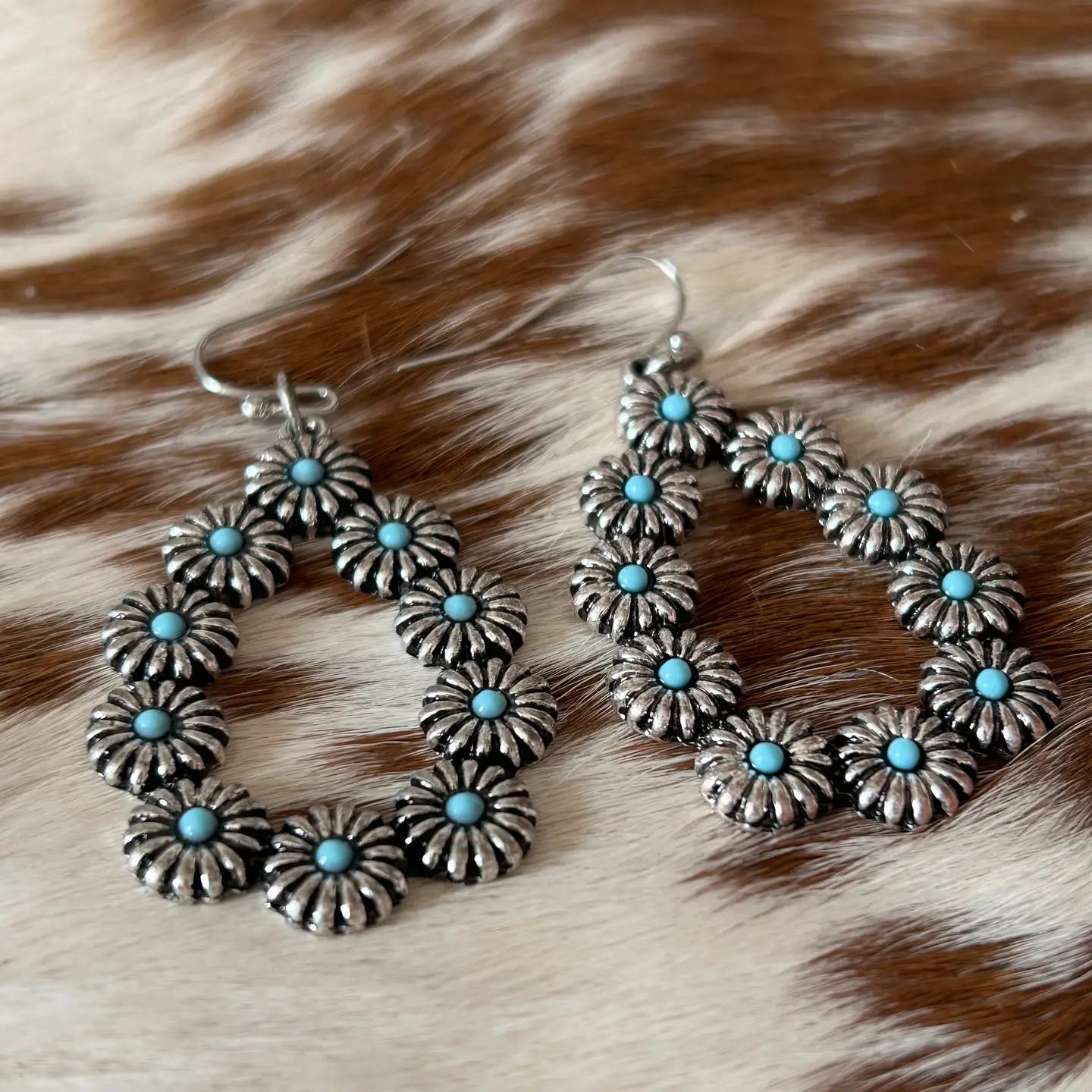 An Oblong-Shaped Earring with Little Flower Design