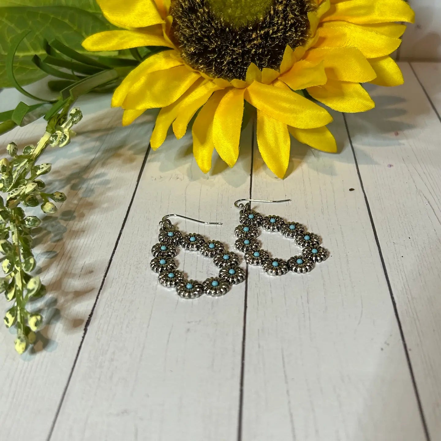 An Oblong-Shaped Earring with Little Flower Design