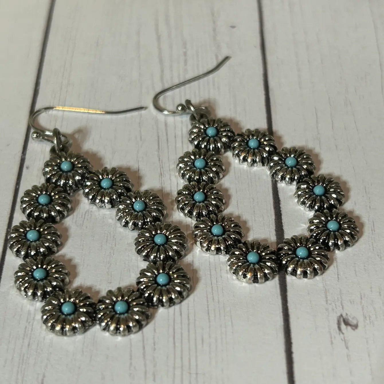 An Oblong-Shaped Earring with Little Flower Design