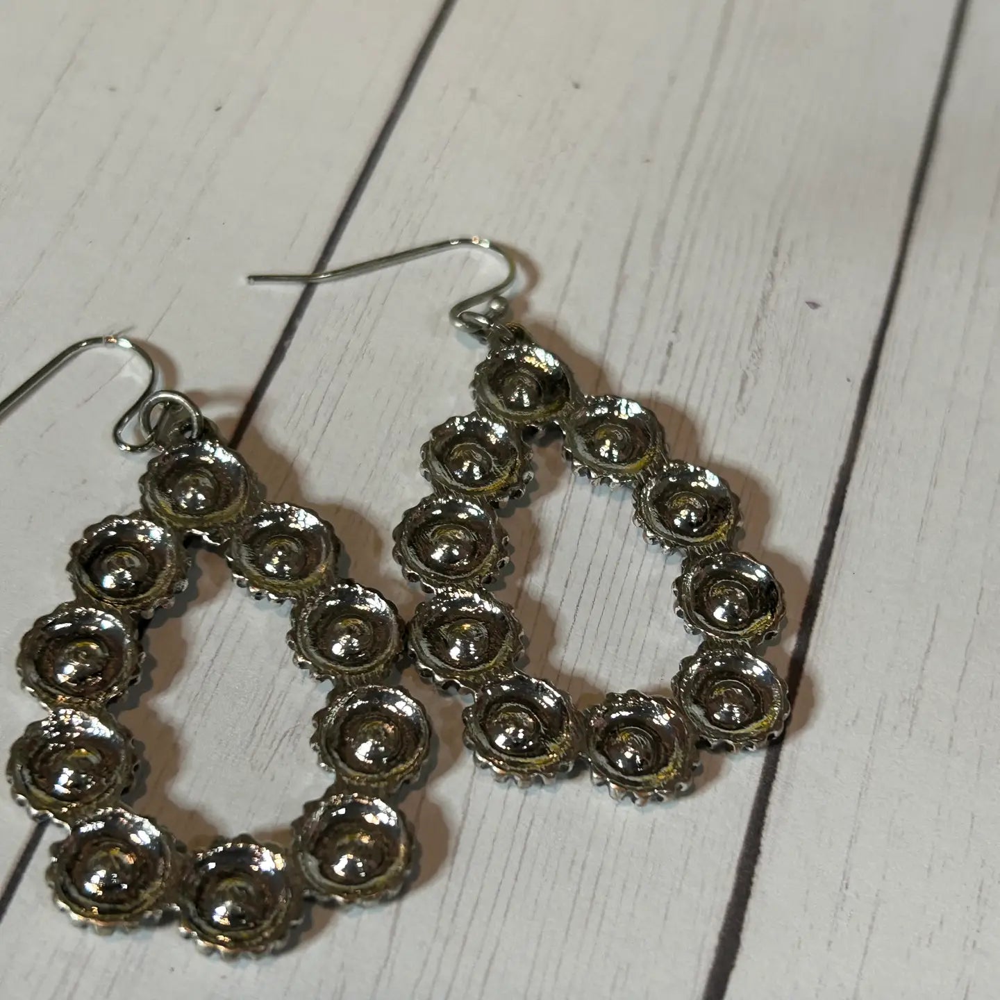 An Oblong-Shaped Earring with Little Flower Design