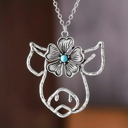 Silver Pig Necklace Featuring a Flower Design